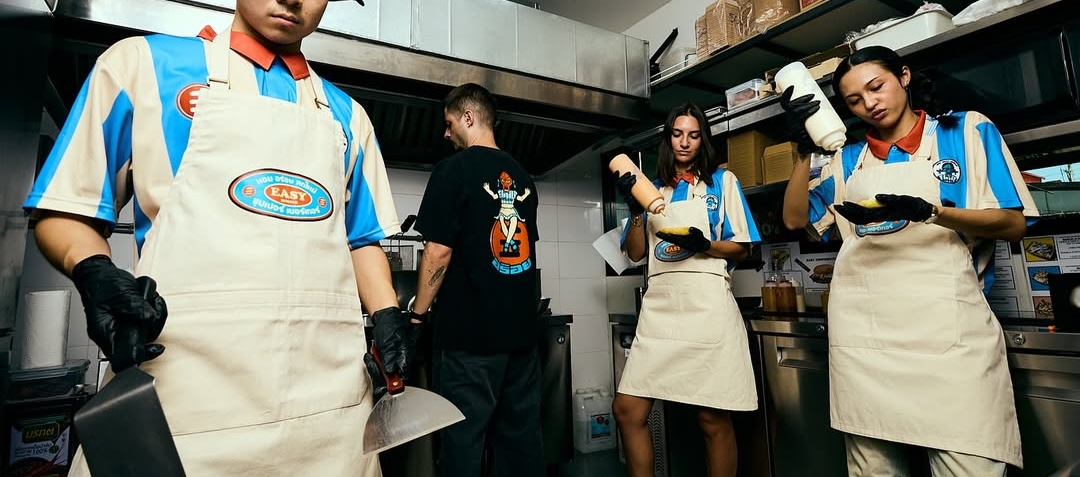 Easy Burger crew smashing burgers in the kitchen