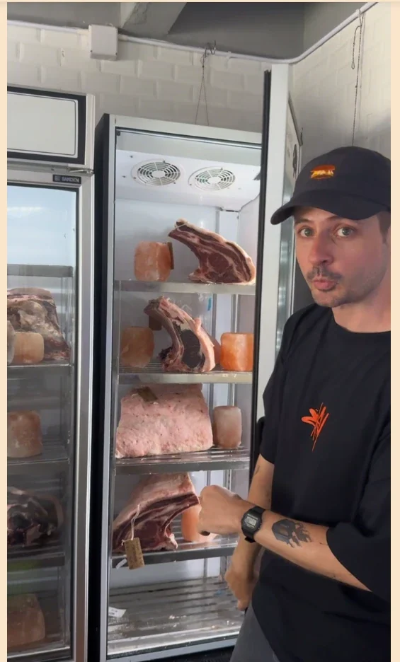 Tom next to the dry-aging cabinet